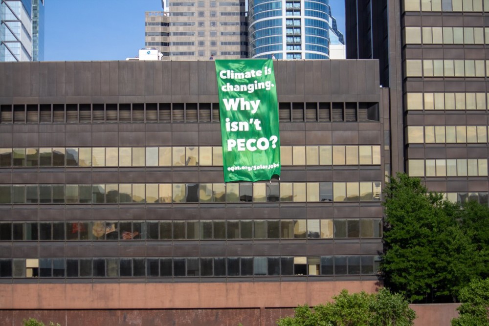 Three Activists Arrested After 50-Foot Banner Hung From PECO HQ